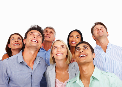 Group of multi racial business people looking up at copyspace