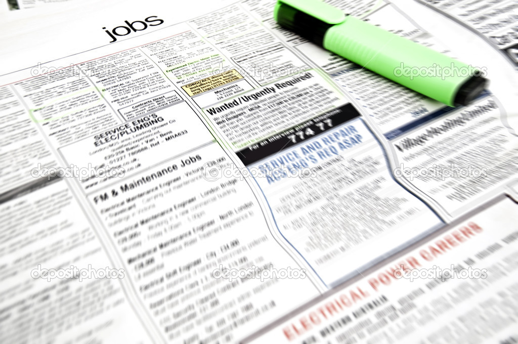 Job ads in newspaper page with marker and some jobs marked