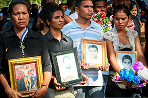 Thousands of people commemorated the 17th anniversary of the Santa Cruz massacre today with a march from the Motael Church to the Santa Cruz cemetery in Dili. Many mourners carried photographs of loved ones who died or who disappeared on 12 November 1991 when the Indonesian military opened fire on a group of pro-independence supporters during a peaceful demonstration at the Santa Cruz Cemetery. UNMIT Photo/Martine Perret